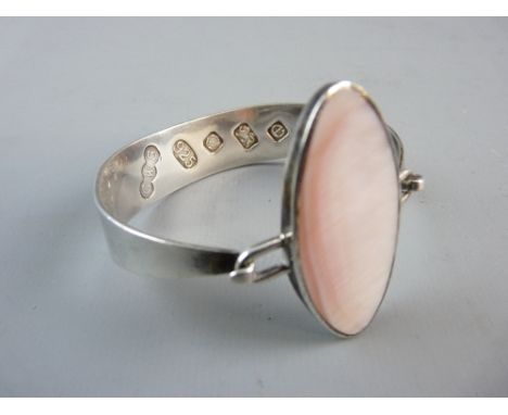 A MODERN SILVER BANGLE with mother of pearl oval top, oversized hallmarked for Sheffield 2004, 1.2 troy ozs gross