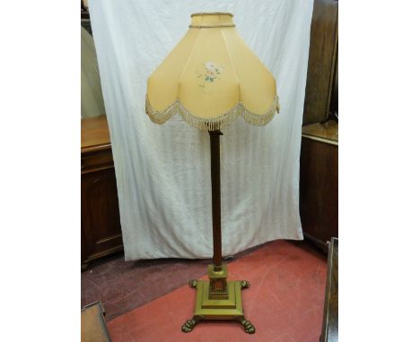 A QUALITY VINTAGE BRASS STANDARD LAMP AND SHADE, the stepped base with applied paw feet and plinth supported Corinthian colum