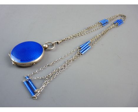 A SILVER AND GUILLOCHE ENAMEL PENDANT POWDER COMPACT AND CHAIN, the cobalt blue decorated case with interior powder puff mark
