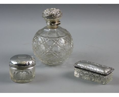 THREE DRESSING TABLE ITEMS with hallmarked silver tops to include an oblong lidded box, Birmingham 1905, a circular lidded po