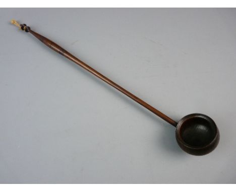 A 19th CENTURY TREEN TODY LADLE with turned handle and bowl, 41 cms long
