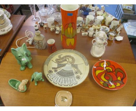 A collection of ceramics to include Poole Delphis and Sylvac, studio pottery to include a table lamp, and a charger and figur