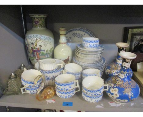 A selection of ceramics to include a pair of Japanese Satsuma vases having floral decoration on a blue ground, a Wade The Fam