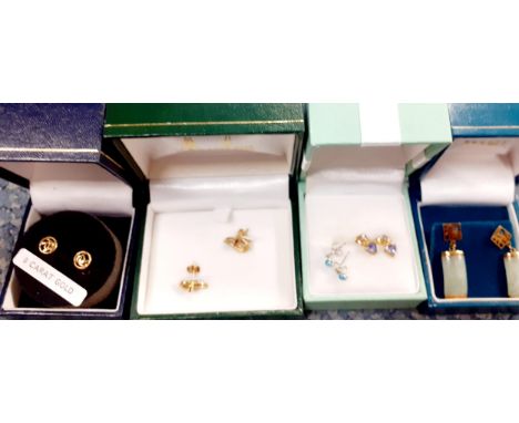A pair of vintage 9ct gold and ruby earrings together with 9ct gold and topaz earrings, 9ct gold and jade Oriental style earr