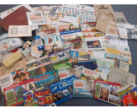 A stamp collection comprising three albums of worldwide stamps, Retro tea card albums, First Day covers, loose franked stamps