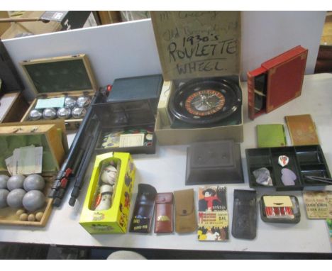 A mixed lot of games to include a 1930s roulette wheel with various boxes of counters, some cases in Bakelite, various darts,