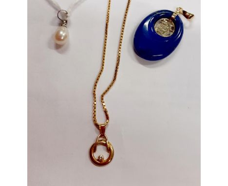 An 18ct white gold plated and pearl pendant, an Oriental style 9ct and blue stone pendant with the Hanzi good fortune symbol 
