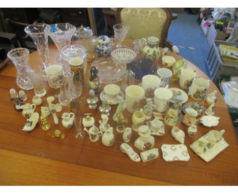 A mixed lot to include crested china including a Carlton china model of a British Gun, cut glass vases, biscuit barrels etc, 
