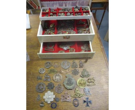 A collection of military cap badges, buttons and badges, some metal detectorist finds, to include for services rendered and 1
