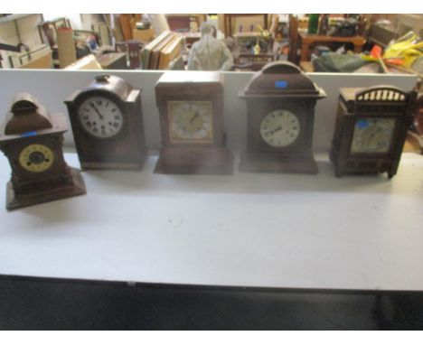 A group of five wooden cased mantel clocks to include a bracket clock having Westminster chimes striking on a gong A/FLocatio