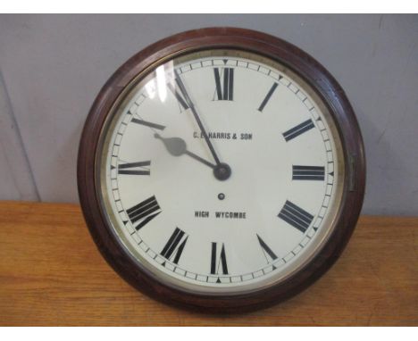 A 20th century stained wooden dial clock inscribed C E Haris & Son, High WycombeLocation: 