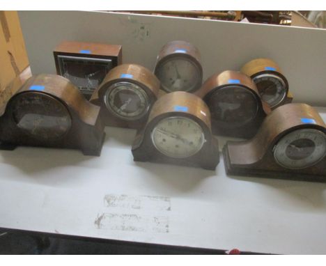 A group of eight early 20th century oak, mahogany and walnut cased Napoleon Hat and other mantel clocks to include and Art De