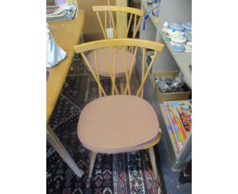 A set of four mid 20th century retro Ercol beech and elm candlestick dining chairs, model 376 