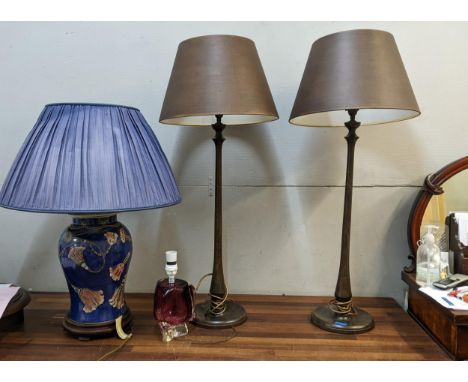 A pair of Porta Romana wood effect table lamps and shades, an Oriental porcelain lamp fashioned as a vase and cover, and a Da