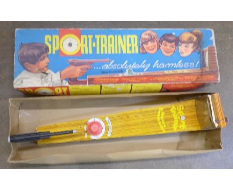 A vintage Sport-Trainer tin-plate shooting game