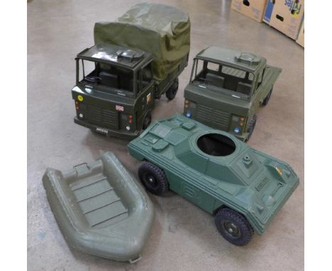 Four Action Man vehicles, Scout Car, two lorries and a dinghy