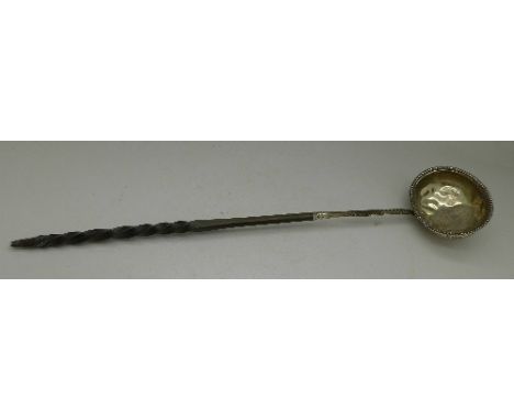 A silver and whalebone ladle