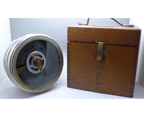 A pigeon timing clock, cased