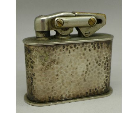 A hammered 835 silver lighter