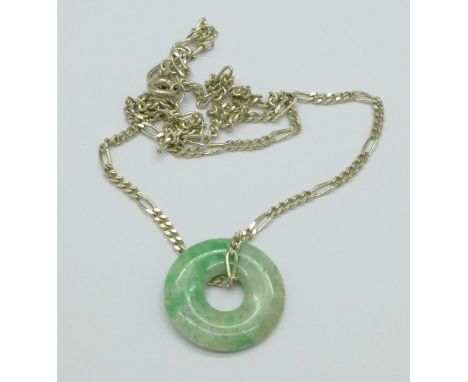A silver chain with jade pendant
