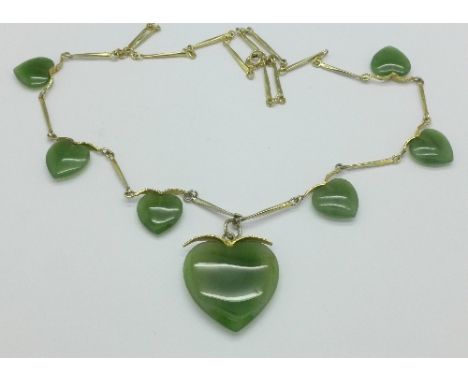 A gilt metal and jade necklace