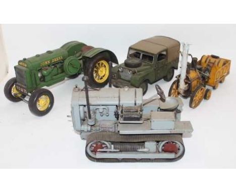 4 various reproduction Tinplate/Pressed Metal models to include John Deere Tractor, Land Rover, Stephensons Rocket, and Hanom