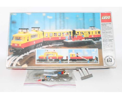 A Lego No. 7740 electric Intercity train set, comprising of three-car unit with various track, Lego figures, and accessories,