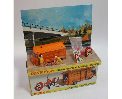 Original issue of the French Dinky No.570a Peugeot J7 "Autoroutes" in orange body with concave hubs, red roof light, appears 