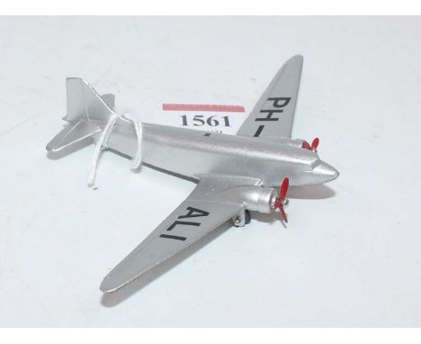 A Dinky Toys No. 60T pre-war Douglas DC3 Airliner Dakota finished in silver with 2x 3 blade red propellers, and PH-ALI to win