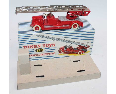 French Dinky Toys No.32D Auto-Echelle De Pompiers in red body with silver detailing and silver ladder and white tyres, in the