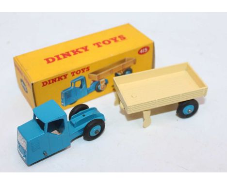 Dinky Toys No. 415 mechanical horse and open wagon, comprising of blue tractor unit and cream trailer both fitted with light 