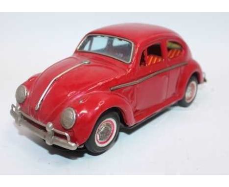 Yoshiya (KO Toys) tinplate and battery operated model of a VW Beetle, red body with blue rear engine cover, loose example (G)