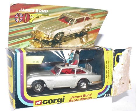 A Corgi Toys No. 271 1/36 scale James Bond 007 Aston Martin comprising silver body with red interior, James Bond figure and B