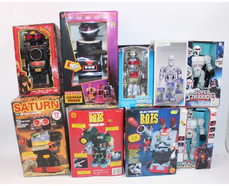 Nine various boxed battery operated and clockwork tinplate and plastic robots and space toys, mixed examples to include a "ma