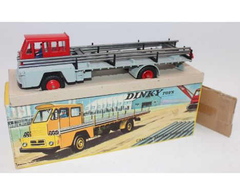 French Dinky 885 Camion Saviem Steel carrier, red cab, grey chassis, blue driver, steel load held by magnets, yellow picture 