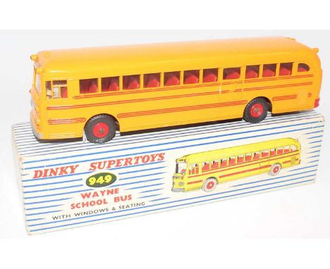 A Dinky Toys No. 949 Wayne School Bus comprising of yellow and red body with red plastic hubs and school bus livery, housed i