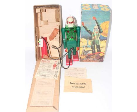 Dux Astroman No.150 remote control Robot, 1950's green plastic body, red feet and hand controller, white head with a clear pl