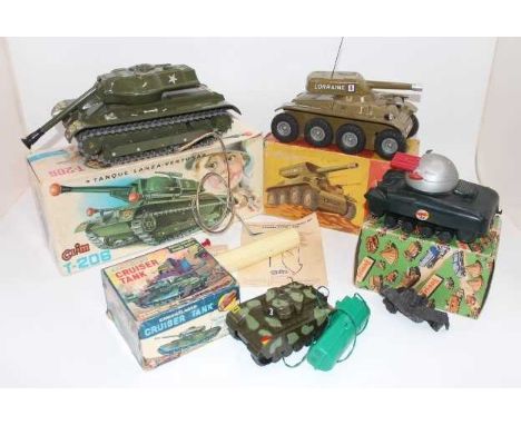 4 various boxed tinplate and plastic Military vehicles to include Triang Rocket Firing Tank, in a M116 Sherman Tank Box, Jous