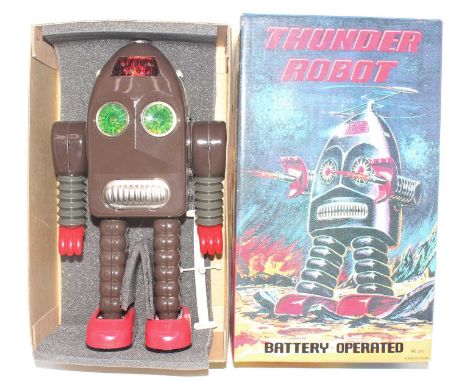 Chinese ME 200 Thunder Robot, battery-operated, comprising brown body with green eyes, red feet, in the original foam packed 