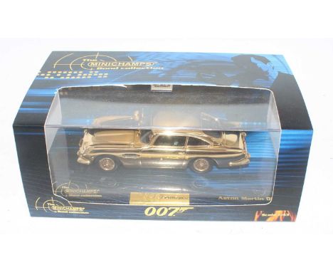 A Minichamps model No. 436 137261 1/43 scale limited edition gold plated James Bond Aston Martin DB5, housed in the original 