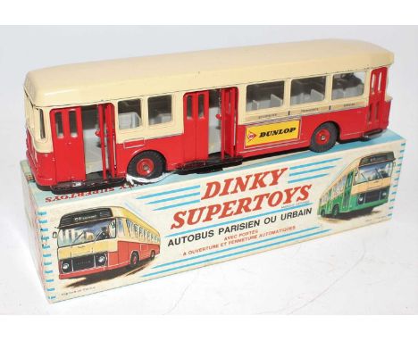 A French Dinky Toys No. 889 Parisian Urban Autobus comprising of red and cream body with Dunlop livery, complete with red hub