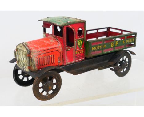 Wells - An unboxed early 20th century vintage clockwork tinplate BP wagon. Item is in a worn condition but the clockwork func