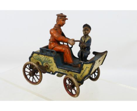 Lehmann - An unboxed vintage tinplate clock work Naughty Boy Wagon. Item appears age worn but in overall fair-good condition.