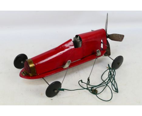 Tether Car - A scratch built tether car with wooden chassis and wheels and metal body, it has a single cylinder engine and ap