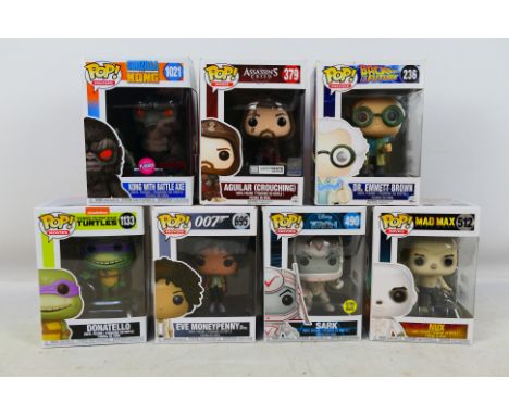 Funko Pop - A group of vinyl figures from the Movies series, Dr Emmett Brown # 236, Eve Moneypenny # 695, Donatello # 1133, N