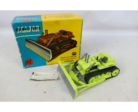 Corgi Toys - A boxed Corgi Major #1107 Euclid TC-12 Tractor with Lever Operated Dozer Blade. The model in lime green with bla