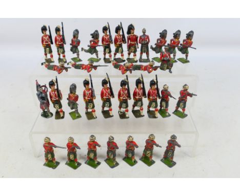 Britains - Over 30 loose vintage Britains Military Highlander Metal figures , some with pivoting arms. Items show signs of us