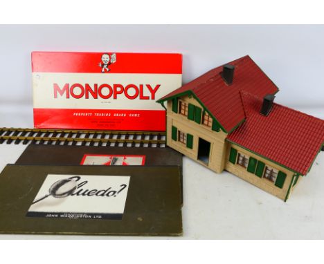 LGB - Waddingtons - An assembled G scale building with 1 piece a G scale straight track. Also a Monopoly set with an addition