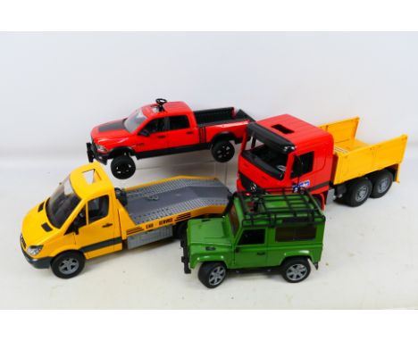 Bruder - Four unboxed plastic 1:16 scale vehicles from Bruder. Lot consists of RAM 2500 Power Wagon; Mercedes Sprinter Car Tr