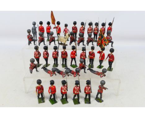 Britains - Approximately 40 loose vintage Britains Metal Guardsmen figures from various sets. Items show signs of age and use